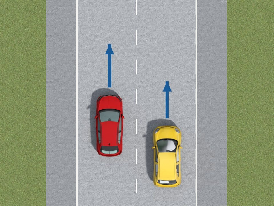 You may cross the broken white line to overtake. Here, the faster bright red car uses the left lane to pass the slower yellow car.