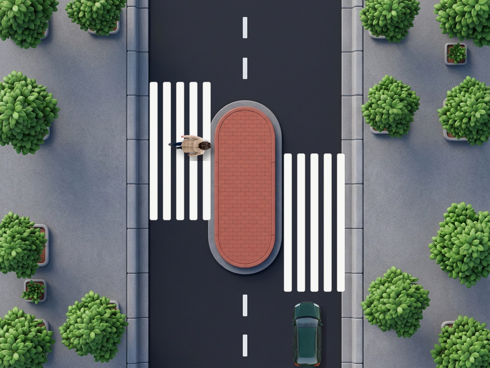 A winged pedestrian crossing: the white stripes are extended back against the direction of the traffic, so drivers stop further from the crossing point and can see pedestrians better, especially truck drivers sitting high. The green estate car stops before the long stripes.